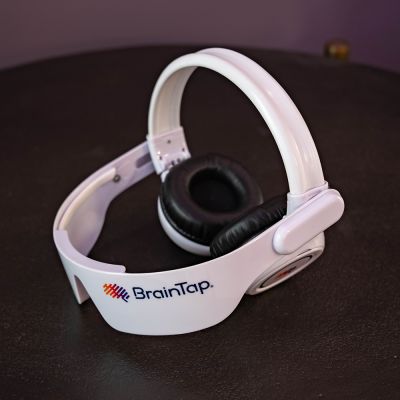 woman wearing BrainTap device